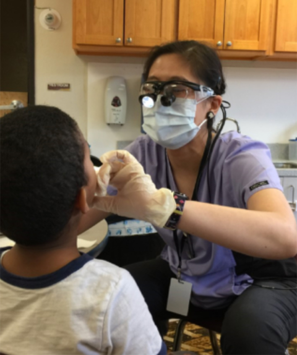 A doctor checking a child