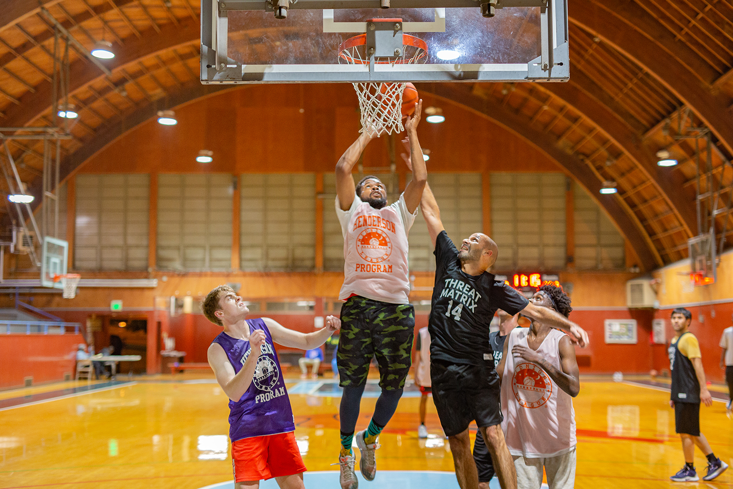 Some men playing basketball