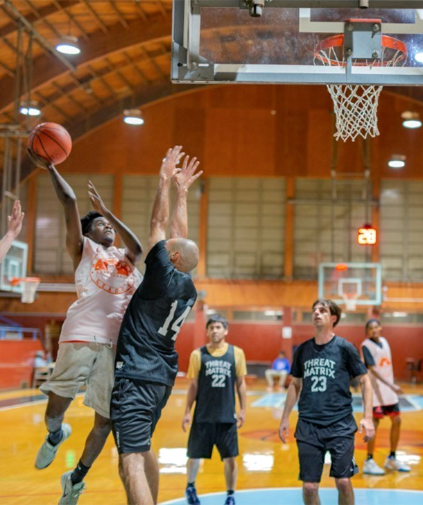 A group of men playing basketball