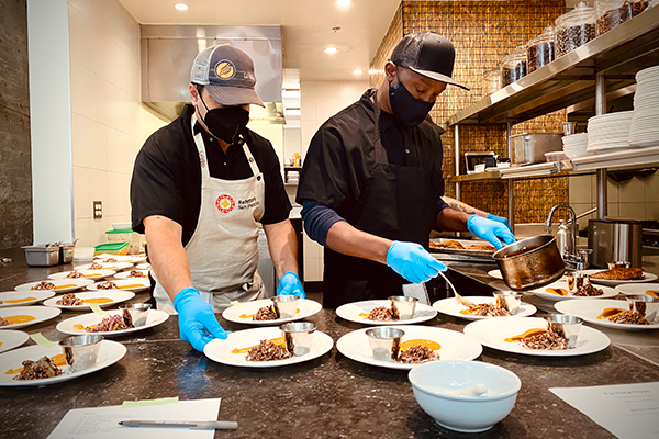 Two men working on the kitchen